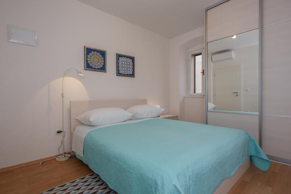 Postel nebo postele na pokoji v ubytování Apartman Mare