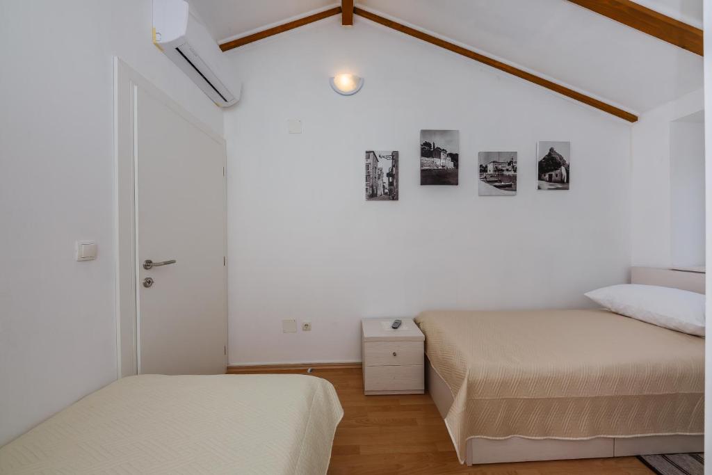Postel nebo postele na pokoji v ubytování Apartman Mare