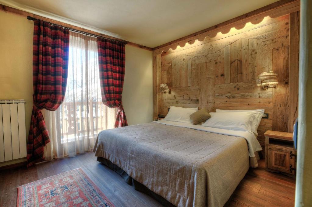 Postel nebo postele na pokoji v ubytování Hotel Meublé Mon Rêve