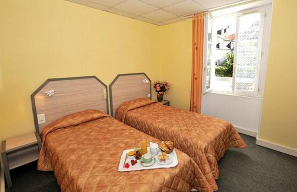 Postel nebo postele na pokoji v ubytování Le Compostelle