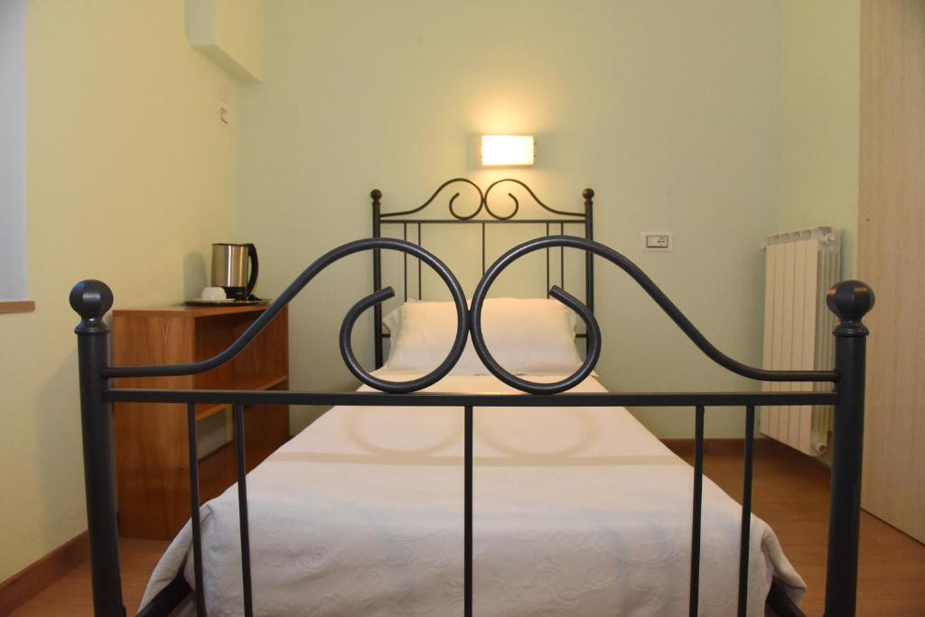 Postel nebo postele na pokoji v ubytování Albergo La Rosetta