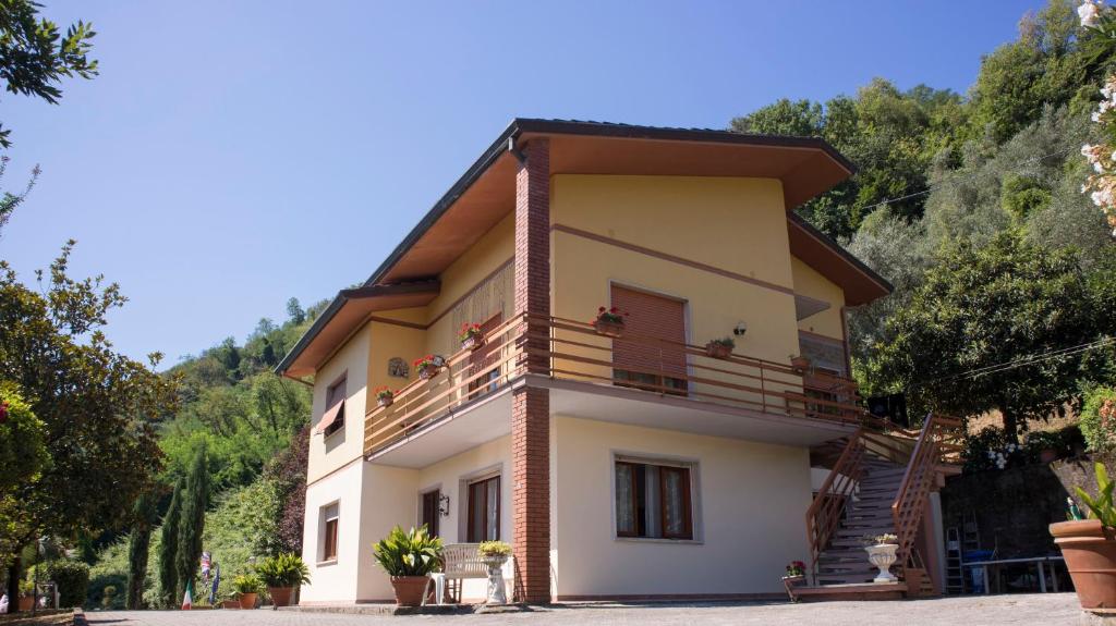a house with balconies on the side of it at Morianese Residence in Lucca