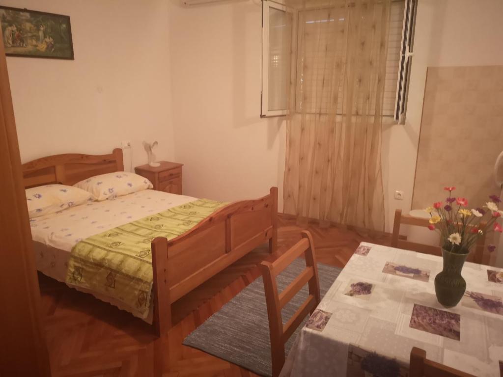 Postel nebo postele na pokoji v ubytování Apartmani Sea