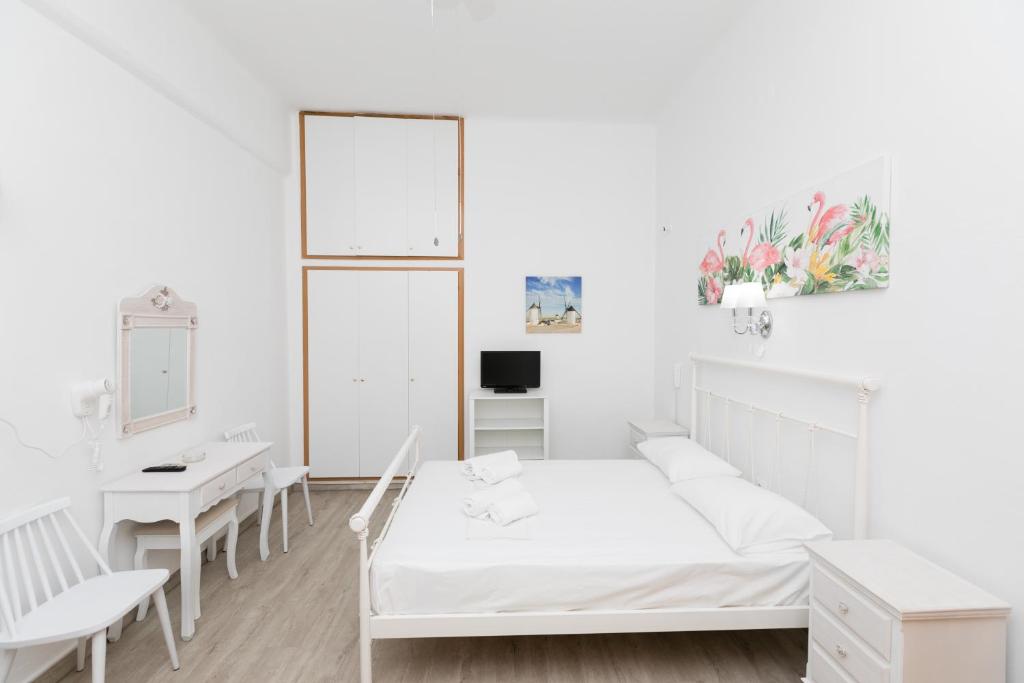 A bed or beds in a room at Kallithea Studios