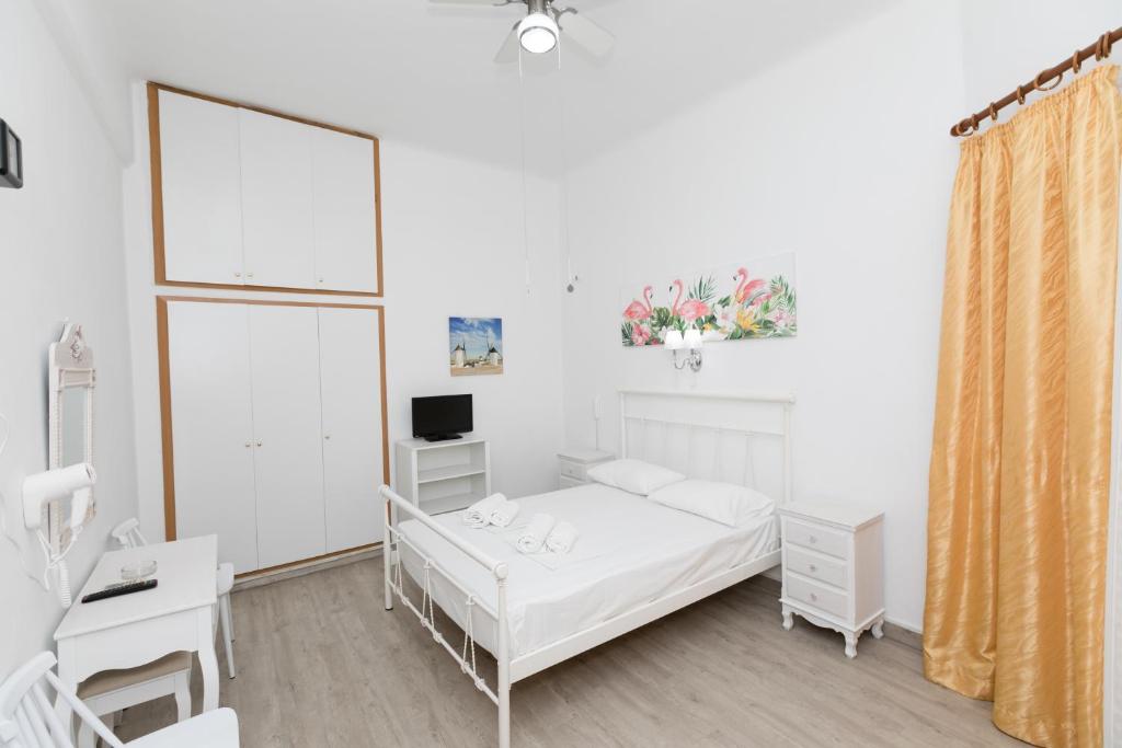 A bed or beds in a room at Kallithea Studios