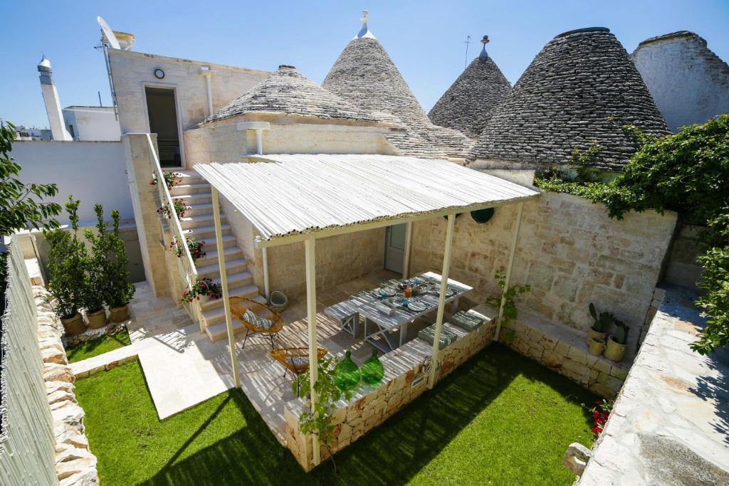 an aerial view of a house with a roof at Hermanas Relais - trulli luxury in Alberobello