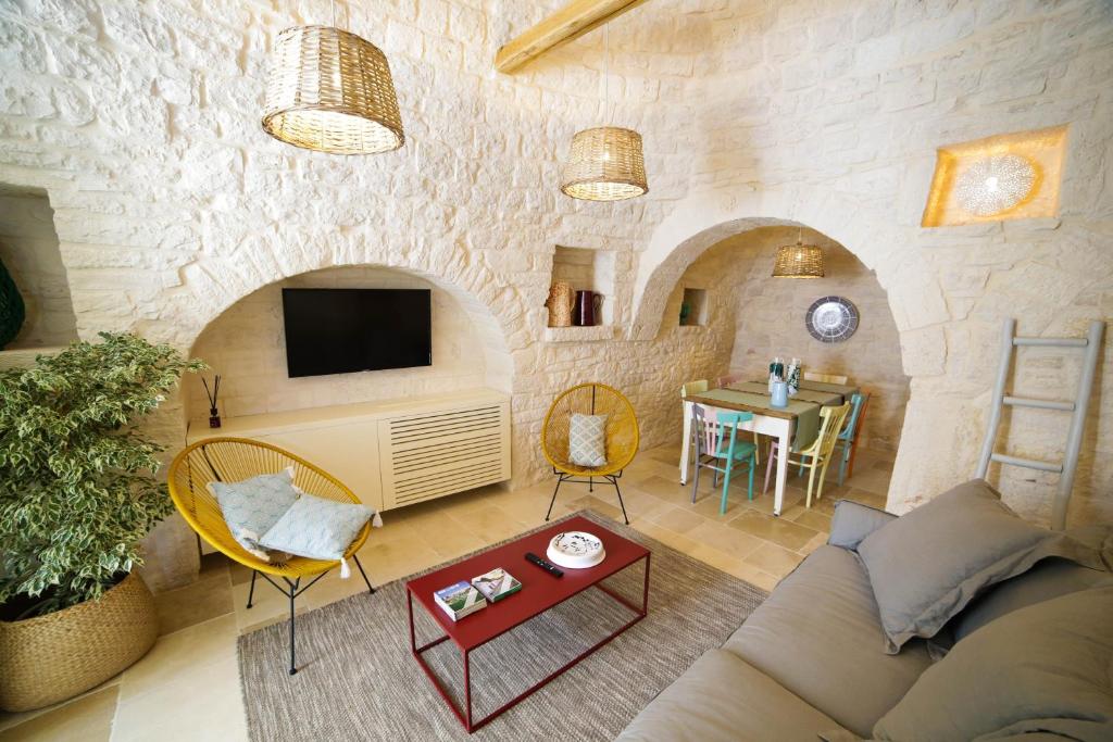 Posezení v ubytování Hermanas Relais - trulli luxury