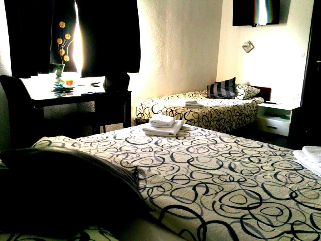 Posteľ alebo postele v izbe v ubytovaní Guest House First Stop