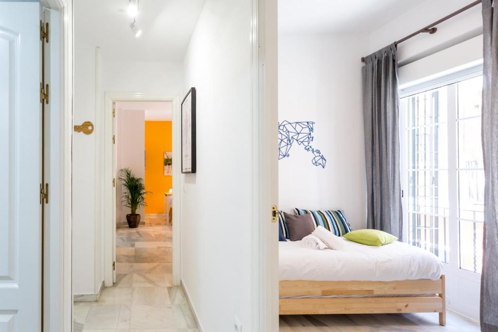 Posteľ alebo postele v izbe v ubytovaní Uniko Home Sevilla