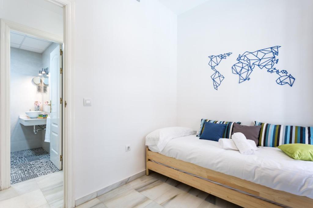 Posteľ alebo postele v izbe v ubytovaní Uniko Home Sevilla