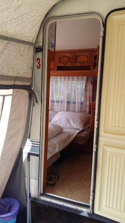 Postel nebo postele na pokoji v ubytování Caravans Magda