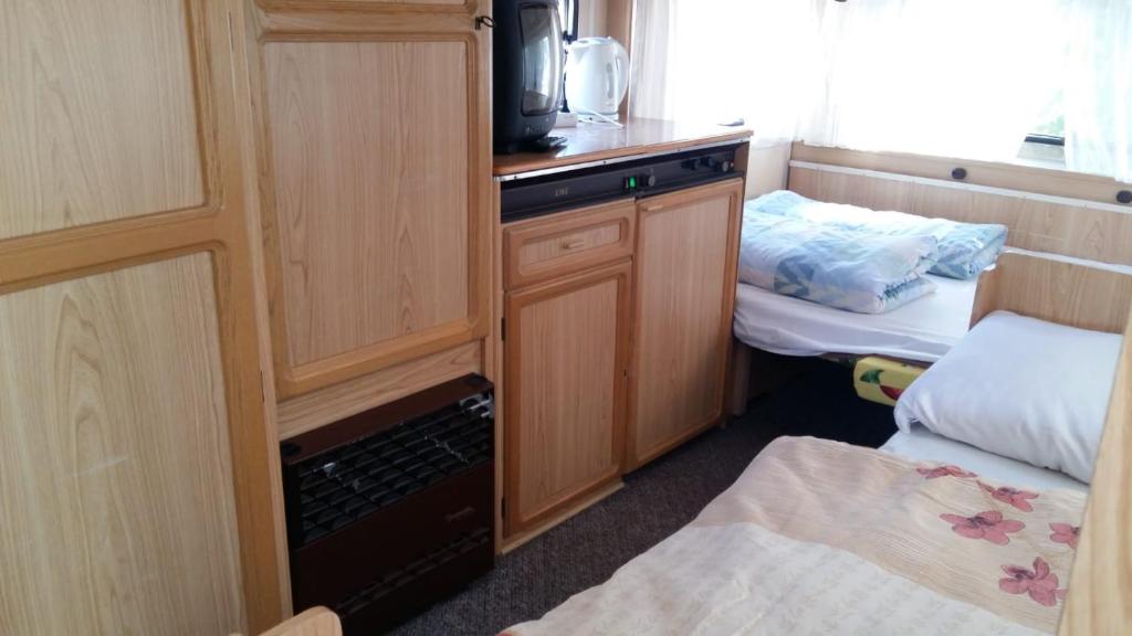 Postel nebo postele na pokoji v ubytování Caravans Magda