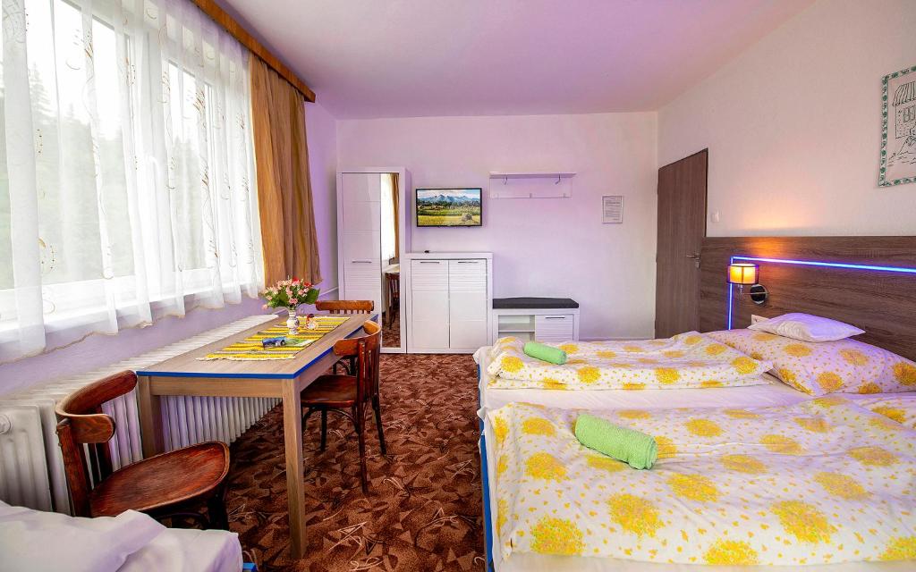 Postel nebo postele na pokoji v ubytování Guesthouse Cyprian