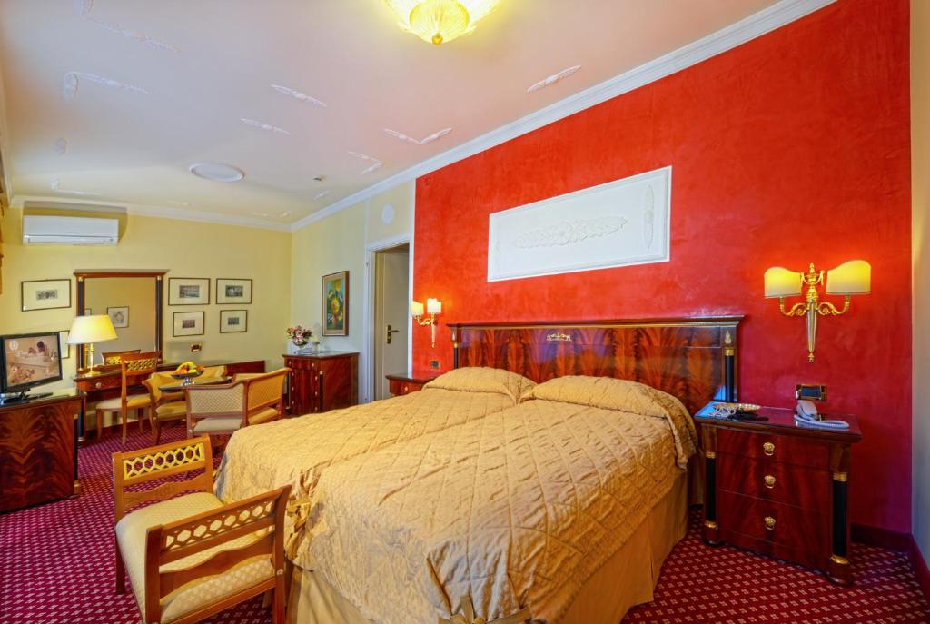 Postel nebo postele na pokoji v ubytování Hotel Aurora Terme