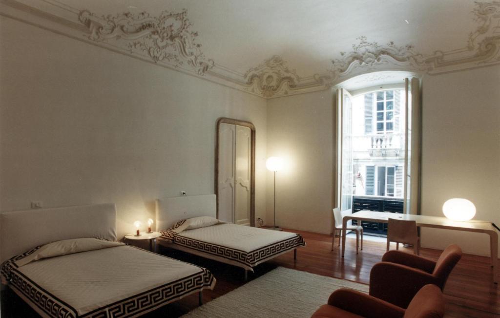 A bed or beds in a room at Palazzo Cicala