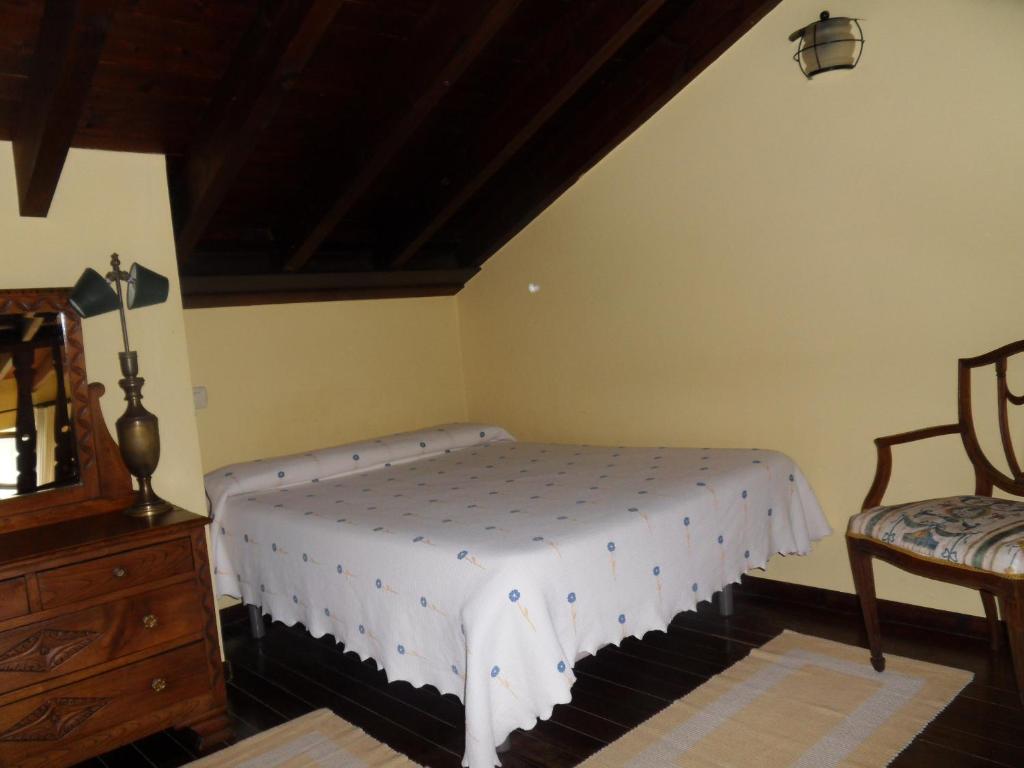 Postel nebo postele na pokoji v ubytování Hotel El Carmen