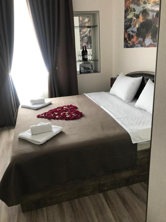 Postel nebo postele na pokoji v ubytování Sweet Rooms Inn