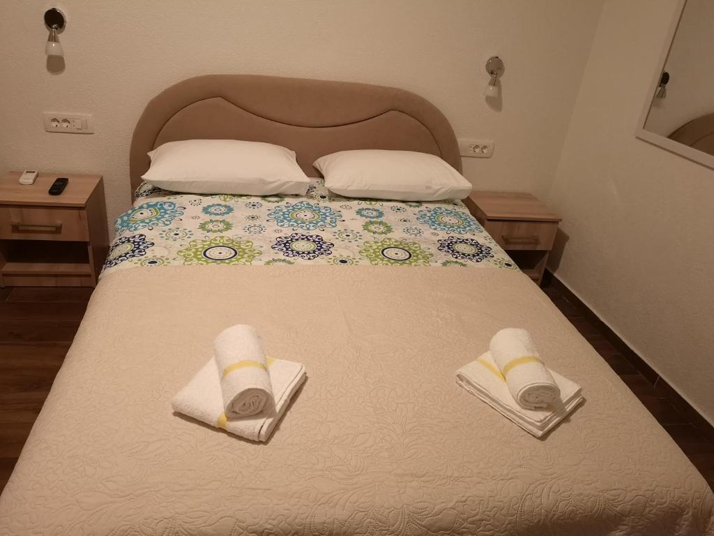 Postel nebo postele na pokoji v ubytování Apartmani Sea