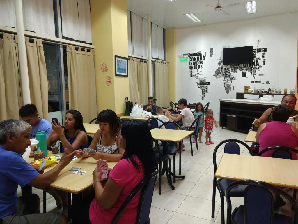 a group of people sitting at tables in a room at Hotel Atlantic in Mar del Plata