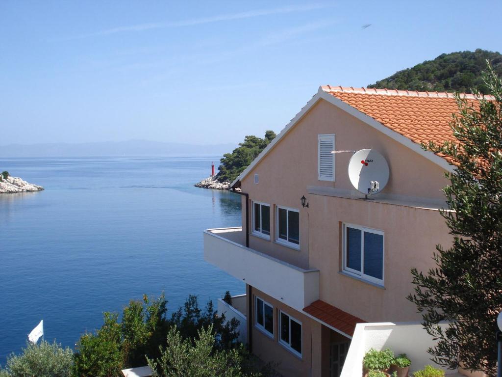 a building with a view of the water at Apartment Marina in Lastovo