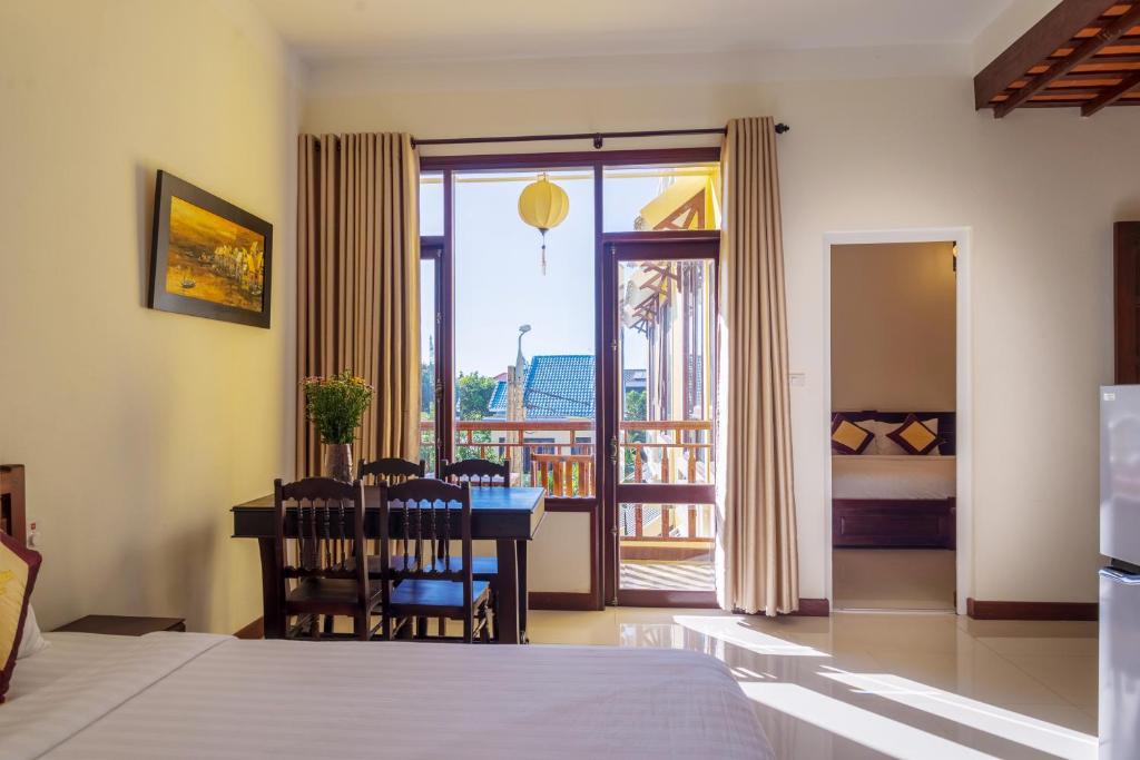 Postel nebo postele na pokoji v ubytování Hoi An Corner Homestay