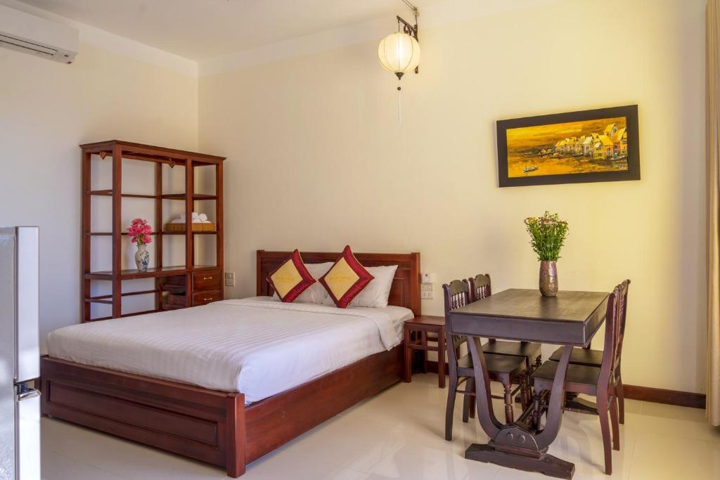 Postel nebo postele na pokoji v ubytování Hoi An Corner Homestay