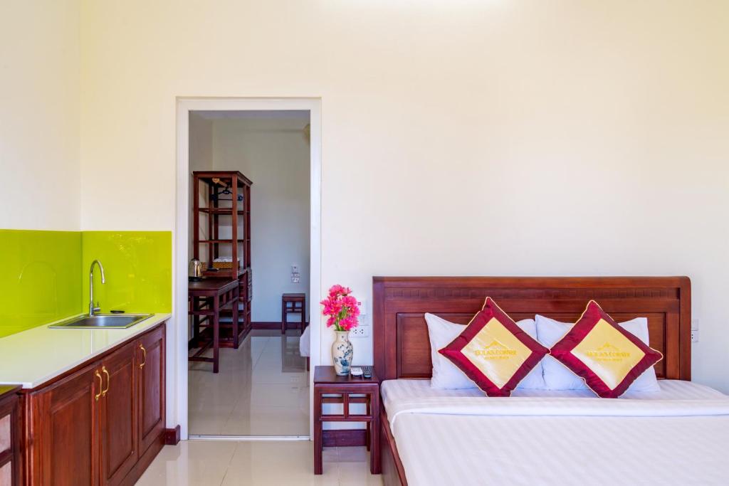 Postel nebo postele na pokoji v ubytování Hoi An Corner Homestay