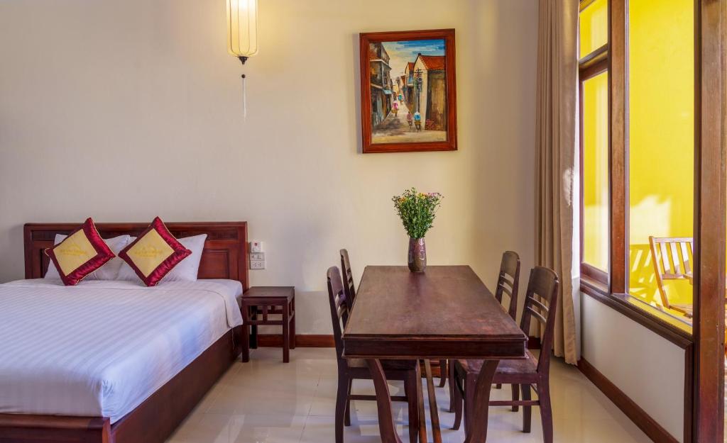 Postel nebo postele na pokoji v ubytování Hoi An Corner Homestay