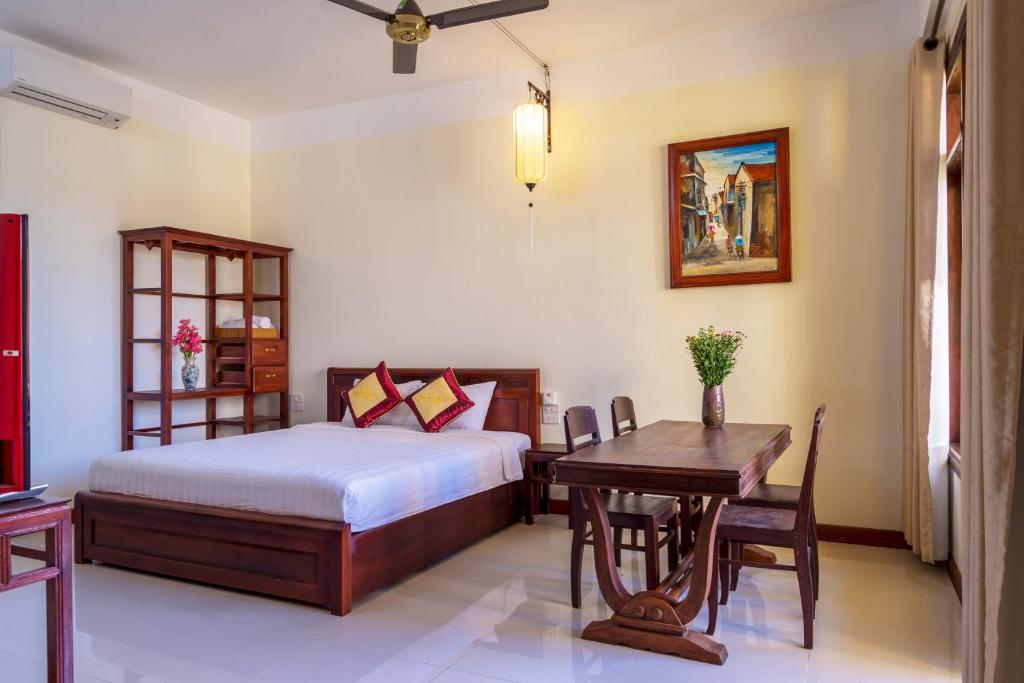 Postel nebo postele na pokoji v ubytování Hoi An Corner Homestay