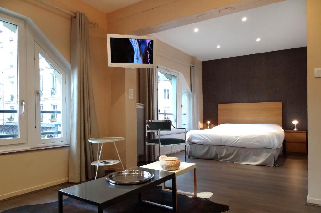 Postel nebo postele na pokoji v ubytování Les Carmes