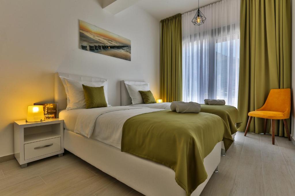 Postel nebo postele na pokoji v ubytování Apart Hotel Sea Fort