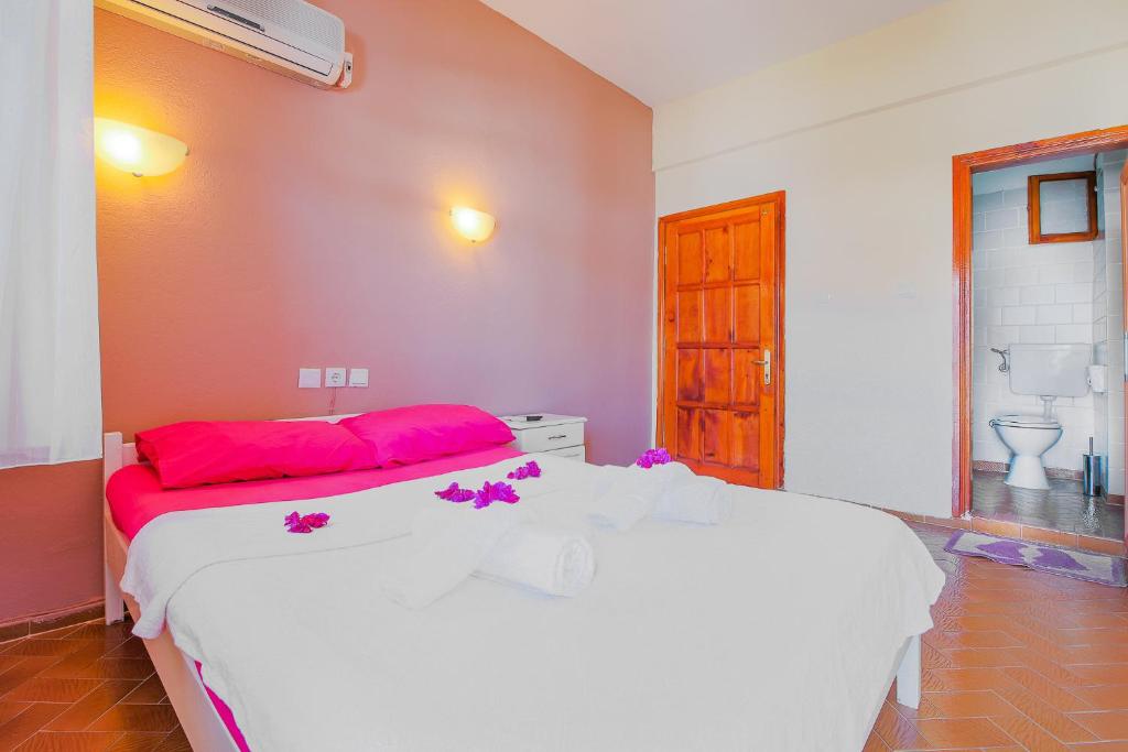 A bed or beds in a room at Saray Otel