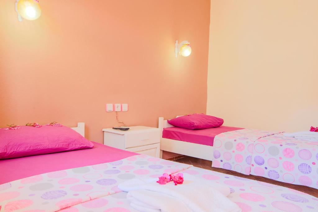 A bed or beds in a room at Saray Otel