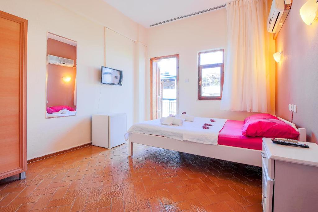 A bed or beds in a room at Saray Otel