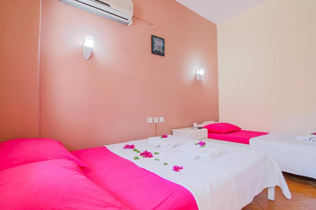 A bed or beds in a room at Saray Otel