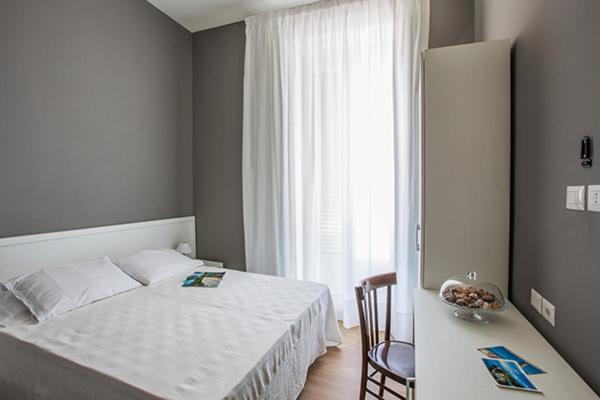 Postel nebo postele na pokoji v ubytování B&B In Centro