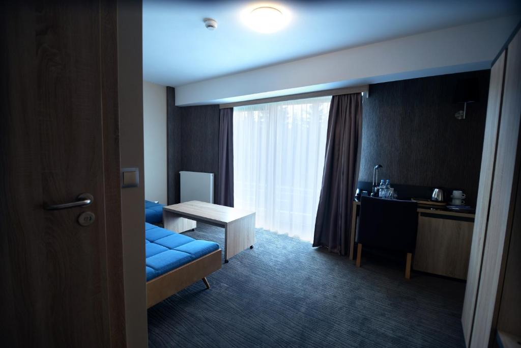 Łóżko lub łóżka w pokoju w obiekcie Hotel Jakuszyce Sport & Spa