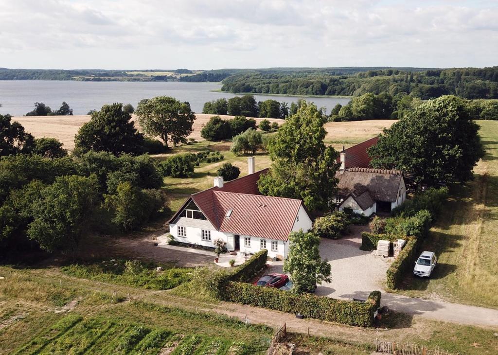 an aerial view of a house with a view of the water at Hørhaven B&B in Fuglebjerg