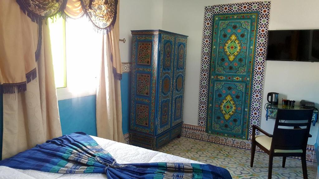 Voodi või voodid majutusasutuse Riad Las Mil y una Noches Tetuan toas
