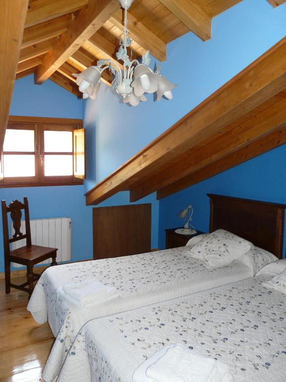 Postel nebo postele na pokoji v ubytování El Mirador del Sueve