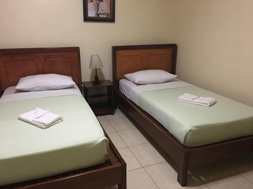Postel nebo postele na pokoji v ubytování Dayview Tourist Home