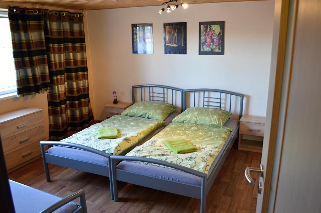 Postel nebo postele na pokoji v ubytování Vinařství Koliba