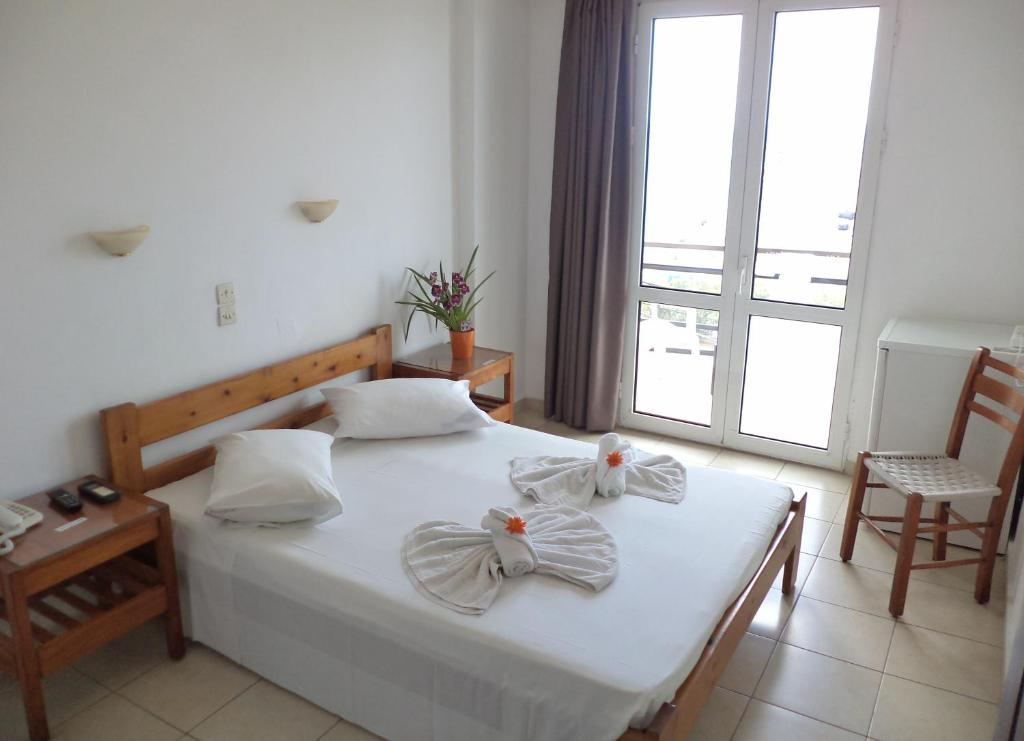 Postel nebo postele na pokoji v ubytování Poseidon Hotel
