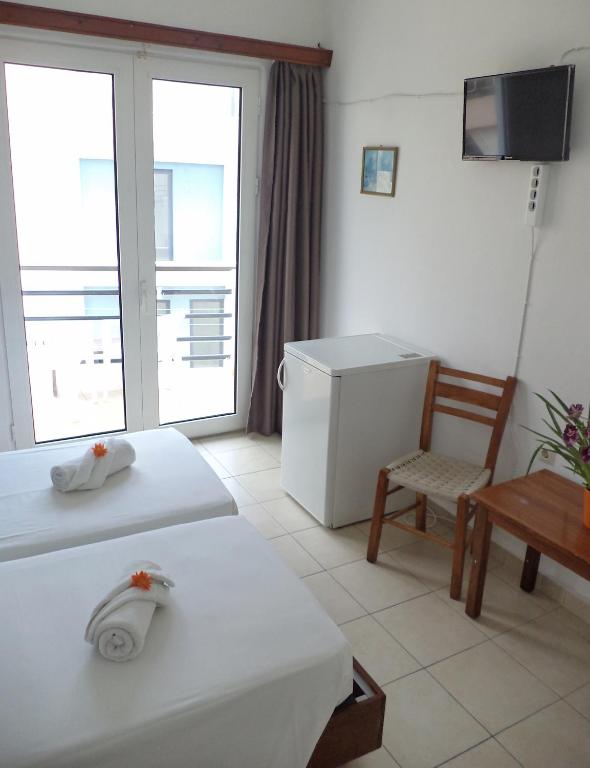 TV a/nebo společenská místnost v ubytování Poseidon Hotel