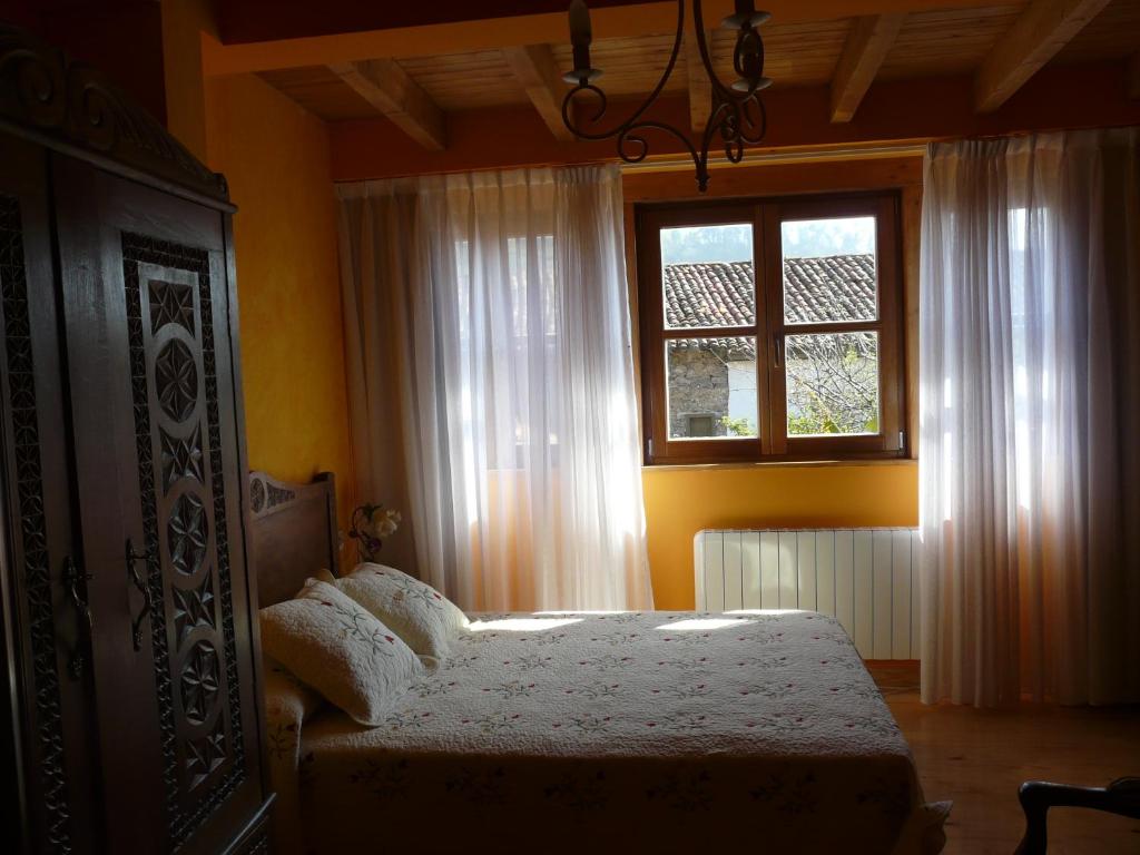 Postel nebo postele na pokoji v ubytování El Mirador del Sueve