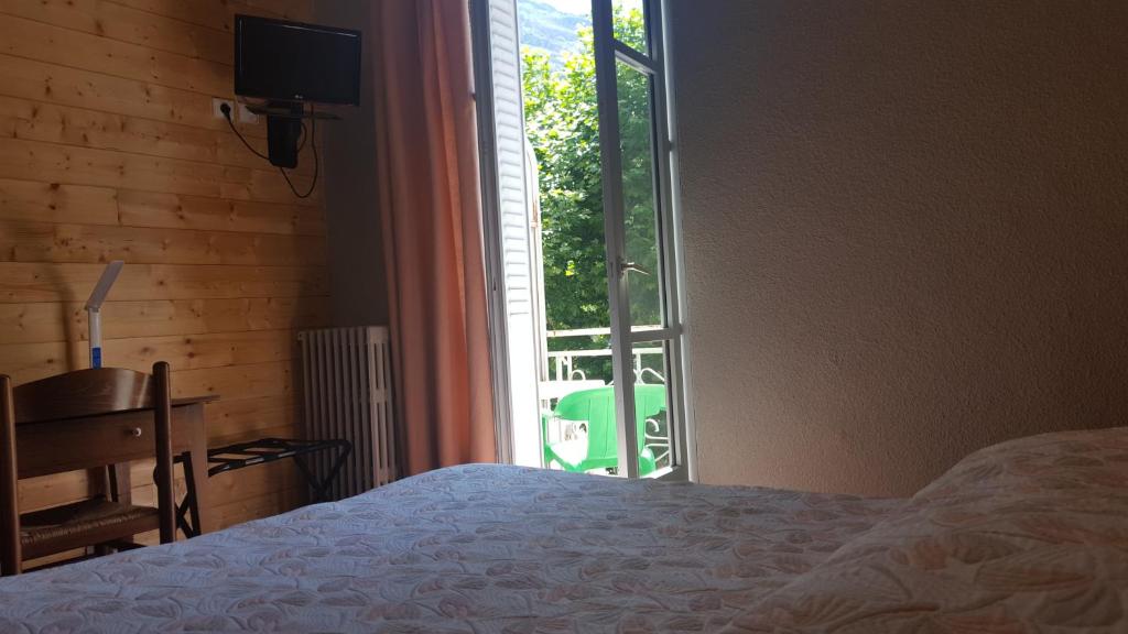 Postel nebo postele na pokoji v ubytování Hôtel Restaurant Glaizette