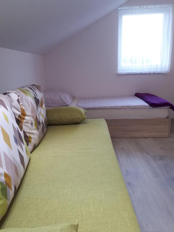 Postel nebo postele na pokoji v ubytování Apartments Zagy