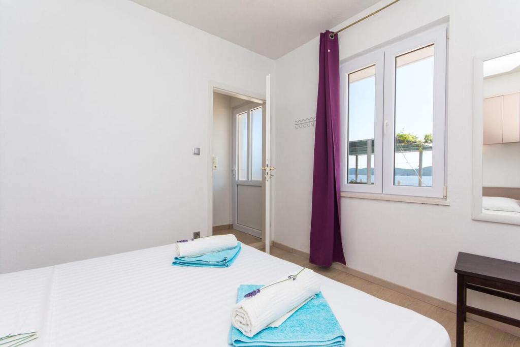 Posteľ alebo postele v izbe v ubytovaní Villa sea oasis Ratac