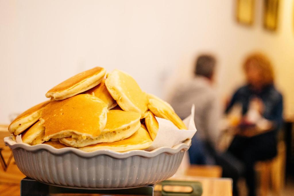 a bowl of banana chips in a white dish at Sintra1012 Boutique Guesthouse in Sintra