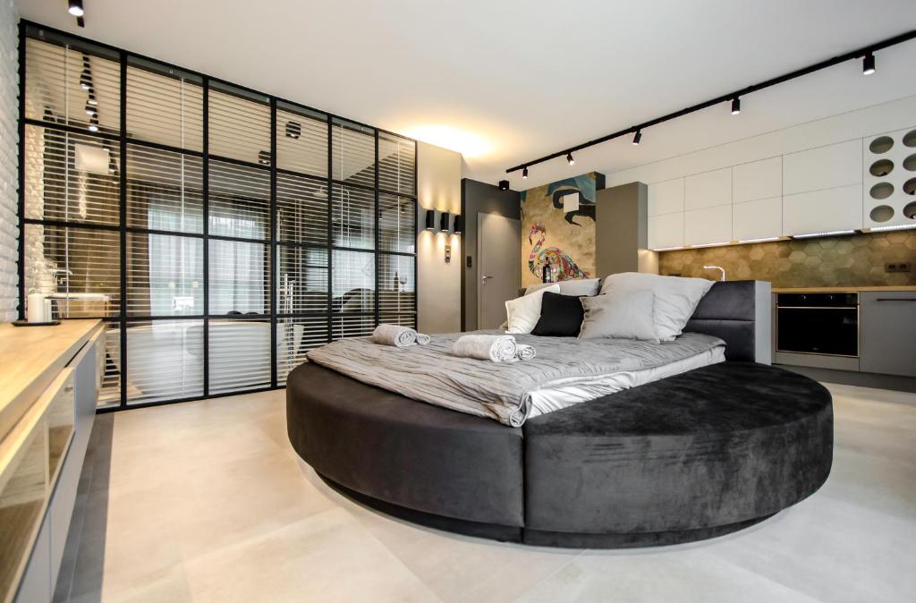 a large bedroom with a large bed in the middle at Flaming in Gdańsk